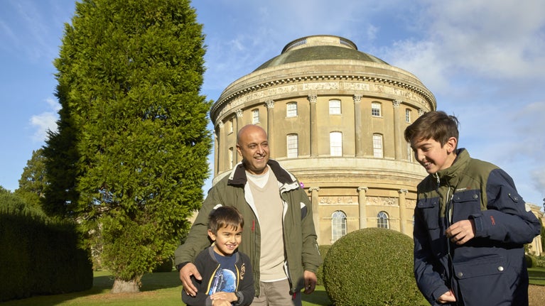 A family in the garden outside the Rotunda at Ickworth, Suffolk